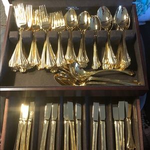 63 piece 22 karat gold overlay fluted flatware.